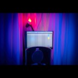 A recording session open on the studio monitor, seen from the vocal position between the isolation curtains
