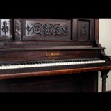 The studio's antique C.F. Manner upright piano, made in New York